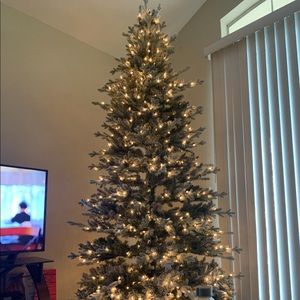 Artificial Prelit snow dusted Christmas tree